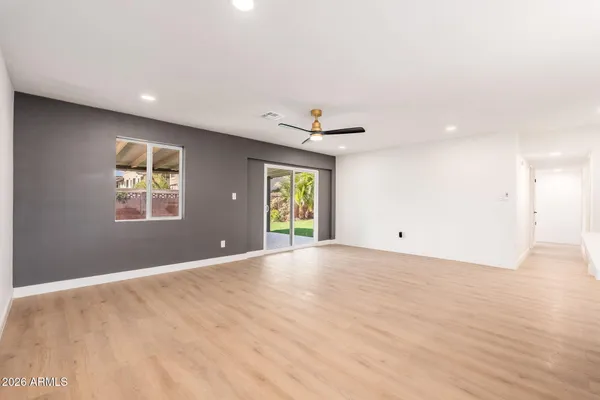a view of an empty room with a window