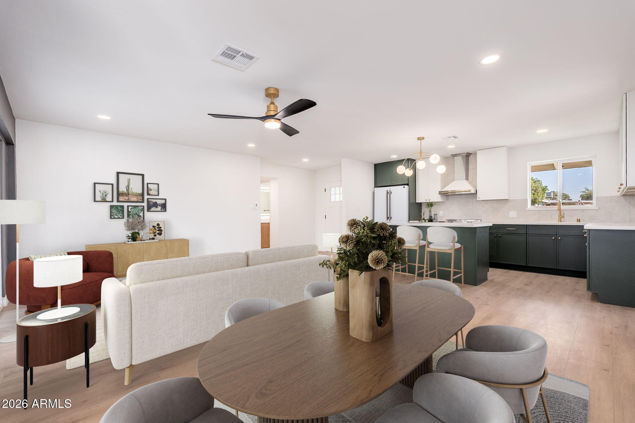 6134 North 9th Street Phoenix, AZ 85014 - Photo 13 of 36 a living room with furniture kitchen view and a dining table