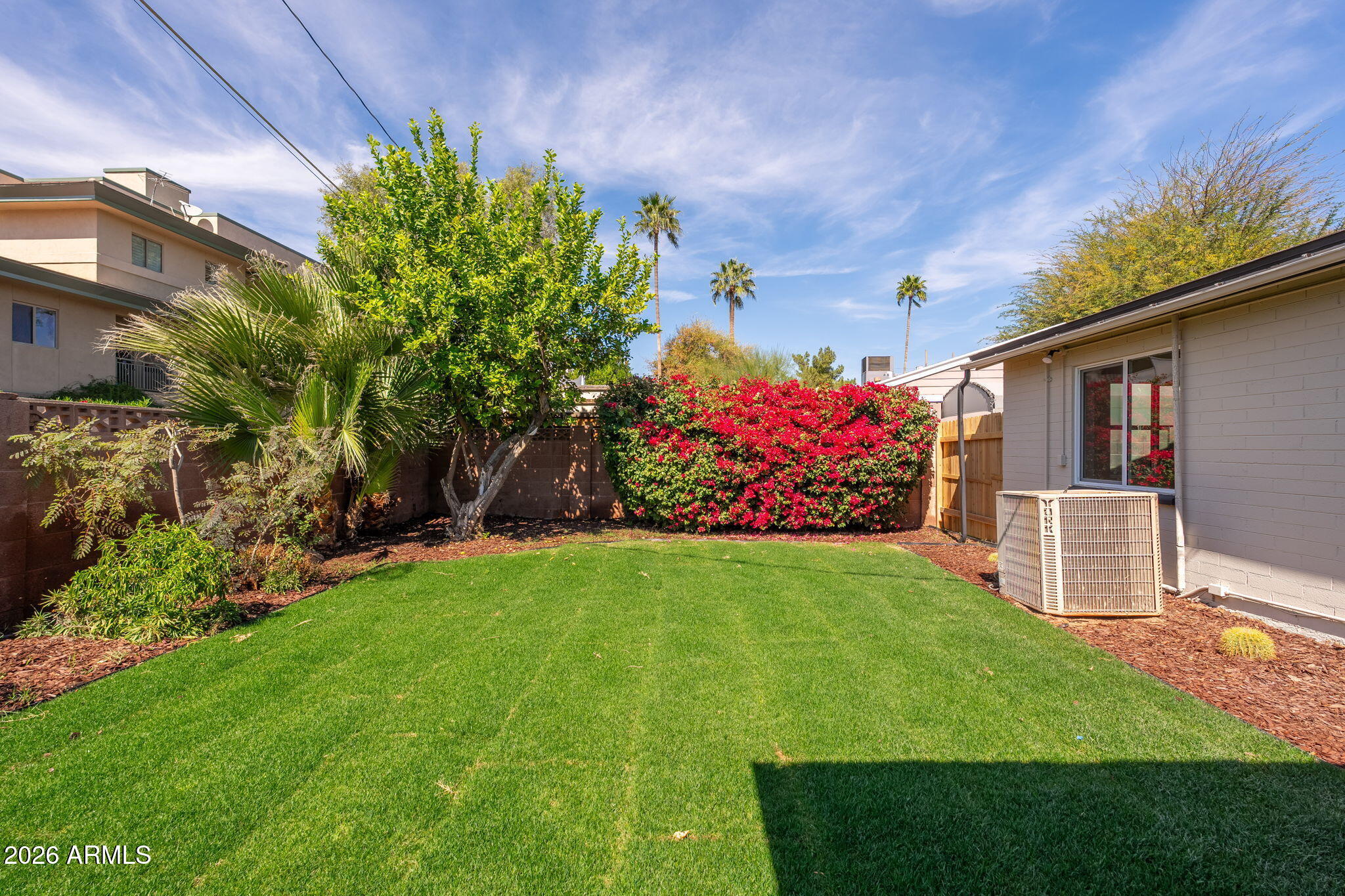 6134 North 9th Street Phoenix, AZ 85014 - Photo 30 of 36 a front view of a house with a yard