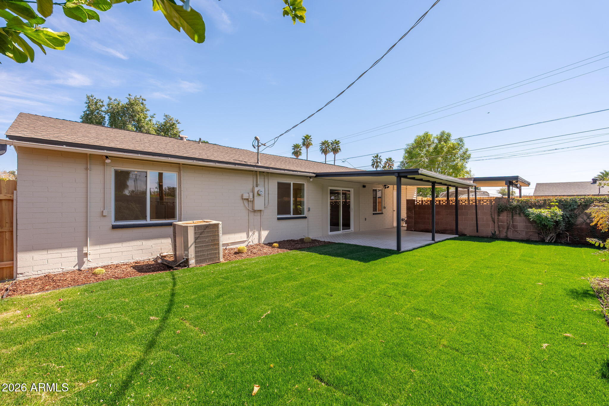 6134 North 9th Street Phoenix, AZ 85014 - Photo 31 of 36 a view of a house with a yard and sitting area