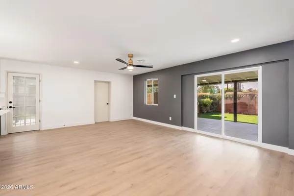 a view of an empty room with a window