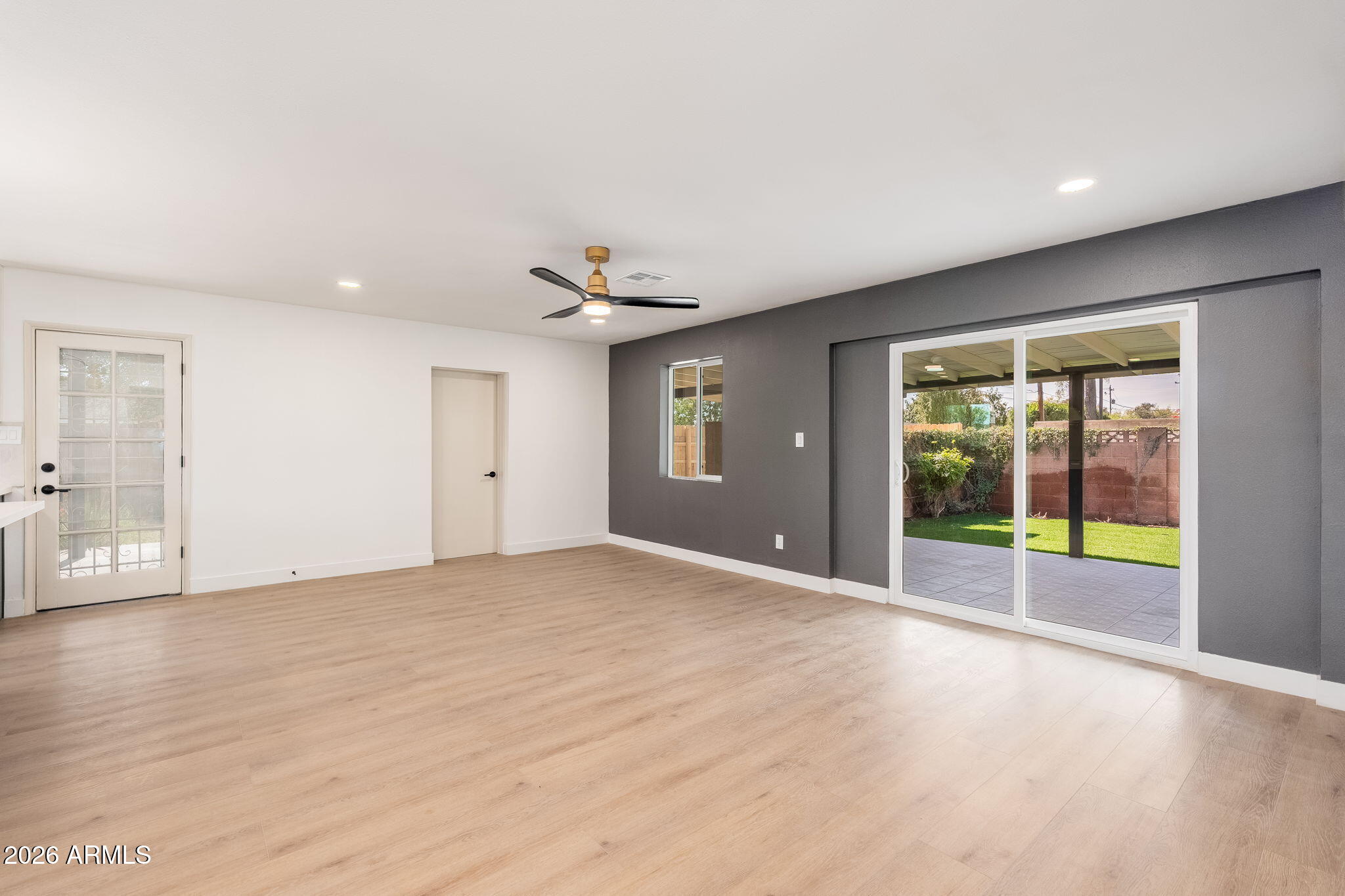 6134 North 9th Street Phoenix, AZ 85014 - Photo 8 of 36 a view of an empty room with a window