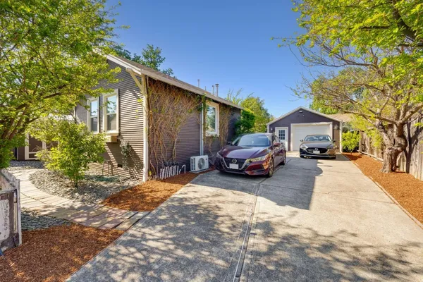 a view of a car park in front of house