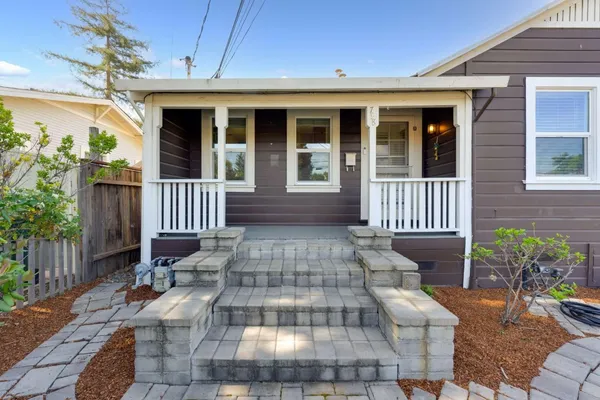 a view of a house with porch and wooden floor