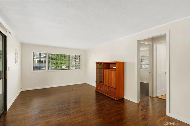 a view of a livingroom with wooden floor