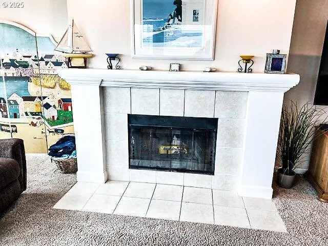 a living room with patio furniture and a flat screen tv