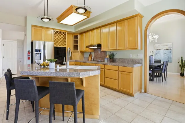 a kitchen with a table and chairs in it
