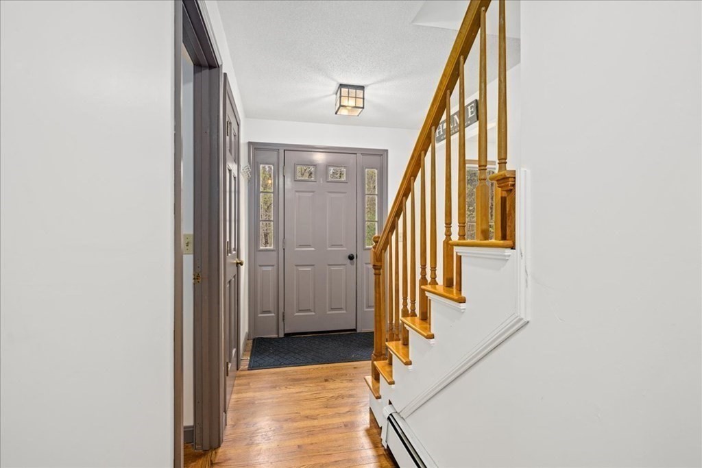 29 Gay Road Brookfield, MA 01506 - Photo 17 of 42 a view of a hallway with wooden floor and staircase