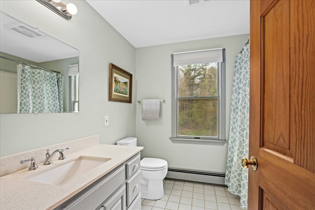 29 Gay Road Brookfield, MA 01506 - Photo 25 of 42 a bathroom with a toilet a sink and mirror