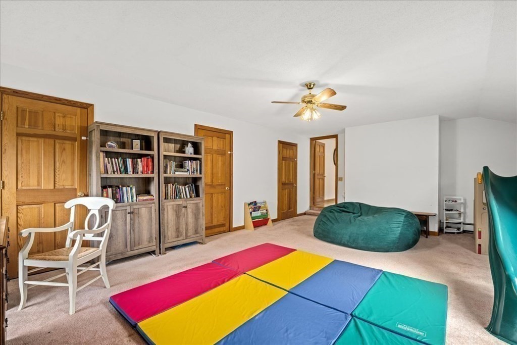 29 Gay Road Brookfield, MA 01506 - Photo 29 of 42 a living room with furniture gym equipment and a rug