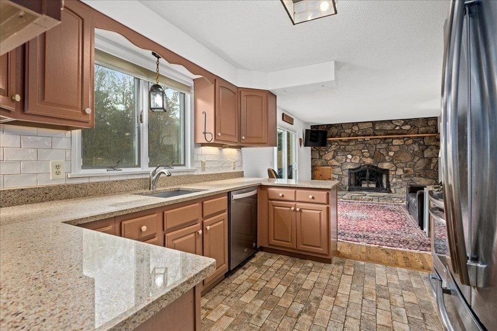 29 Gay Road Brookfield, MA 01506 - Photo 8 of 42 a kitchen with a stove a sink and a refrigerator