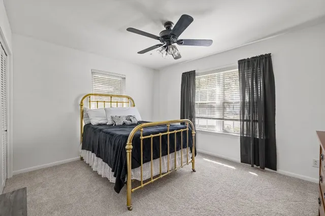 a bathroom with a sink a mirror and shower