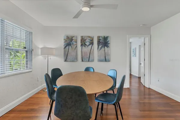 a view of a dining room with furniture and wooden floor