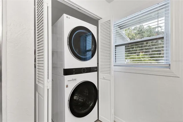 a en suite bathroom with a granite countertop sink and a mirror