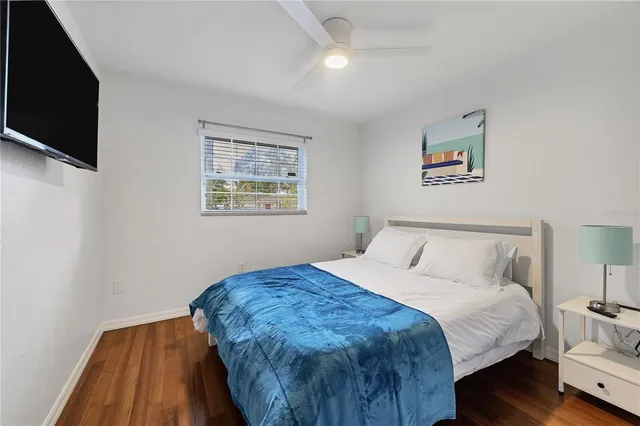 a bedroom with a bed and a table