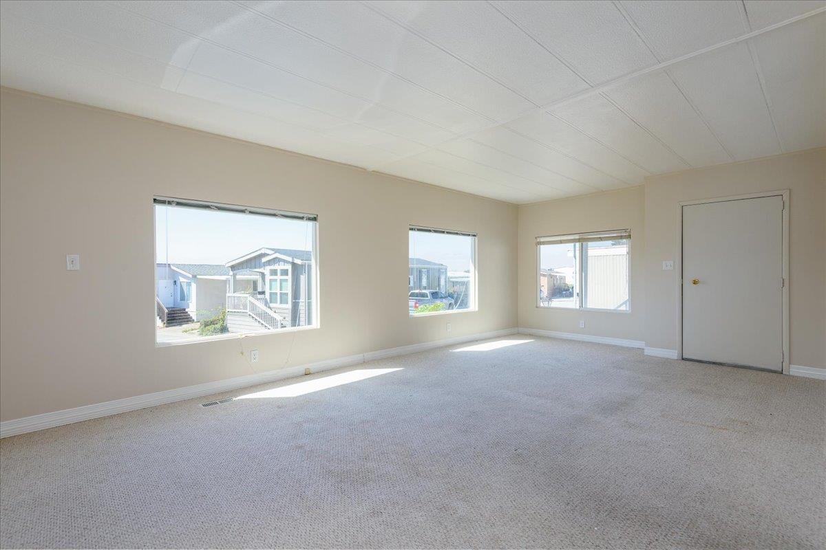 52 Oceanview Avenue, Unit 52 Half Moon Bay, CA 94019 - Photo 2 of 15 an empty room with windows