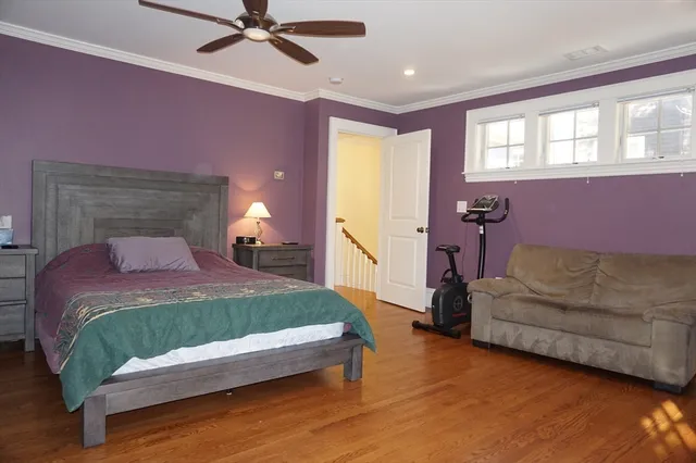 a bedroom with a bed window and couch