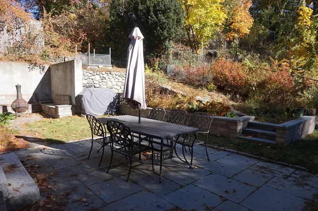 a view of an outdoor sitting area with furniture