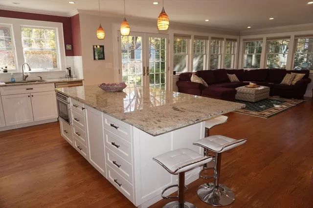 a kitchen with stainless steel appliances granite countertop a stove and a sink