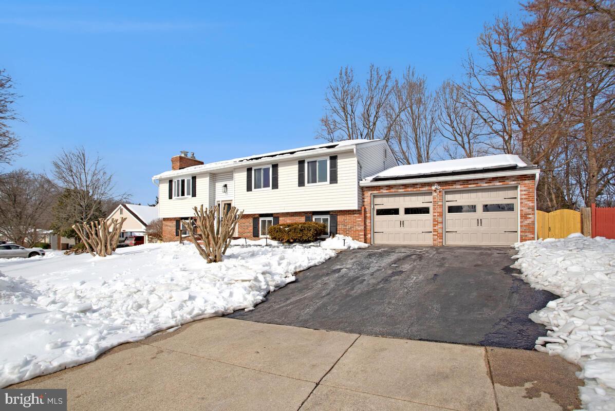 12802 Lode Street Bowie, MD 20720 - Photo 1 of 1 a view of a house with snow on the side of the road