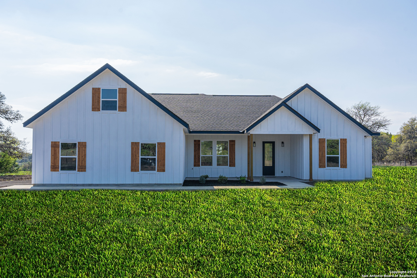 824 Edge Falls Road Boerne, TX 78006 - Photo 1 of 1 a front view of house with yard and green space
