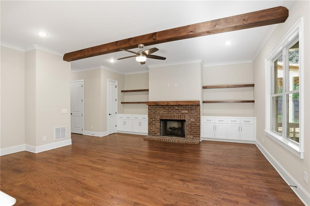 222 Trecastle Square, Unit 21 Canton, GA 30114 - Photo 11 of 33 a view of empty room with wooden floor and fireplace