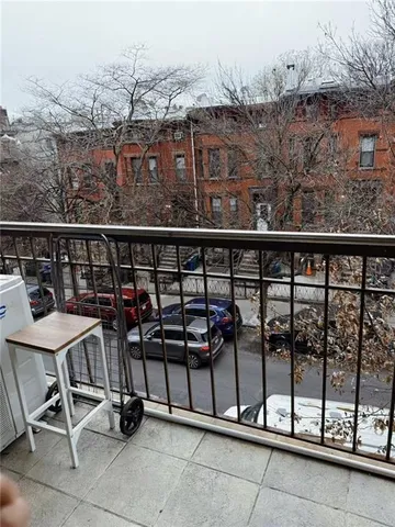 a view of a balcony with chairs