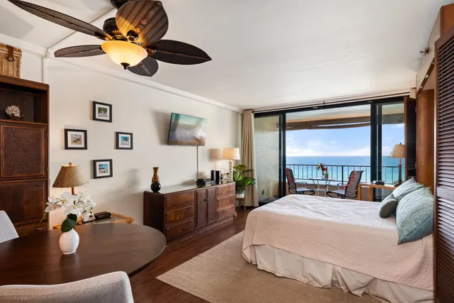 a kitchen with stainless steel appliances granite countertop a sink dishwasher stove and refrigerator with wooden floor