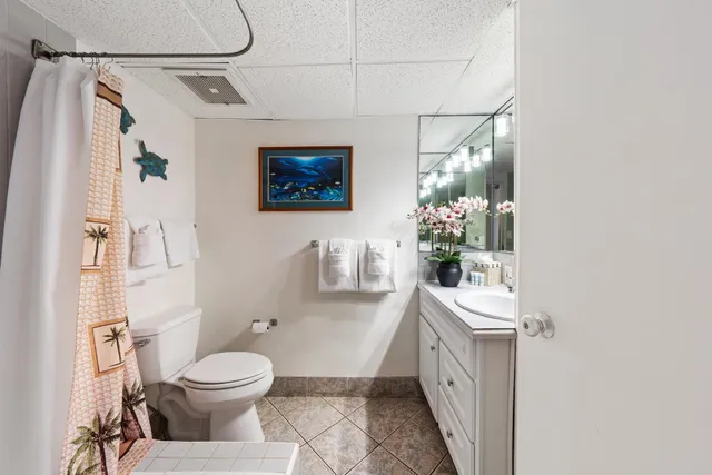 a bathroom with a sink a vanity and a mirror