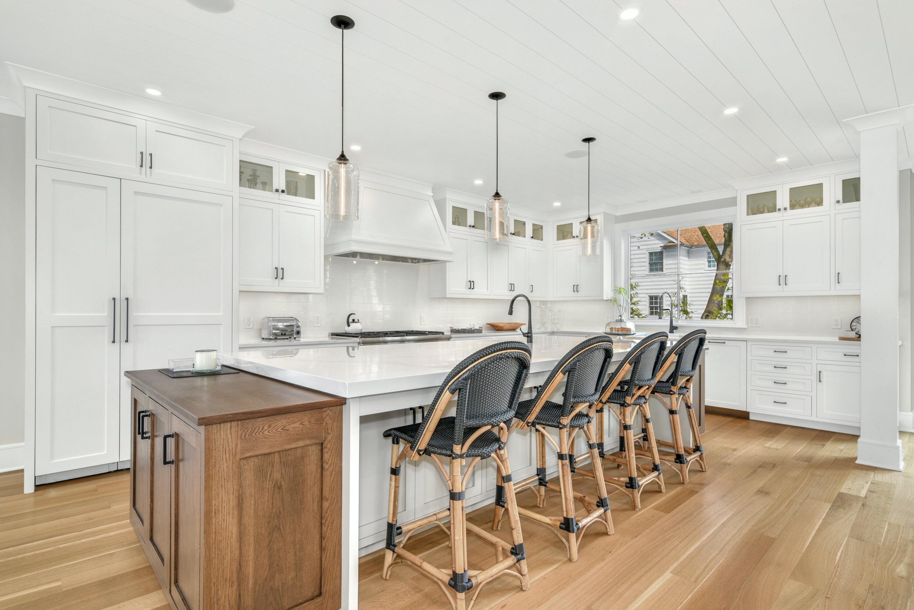 15 Waverly Road Darien, CT 06820 - Photo 13 of 36 a kitchen with stainless steel appliances granite countertop a sink a stove a refrigerator and island with wooden floor
