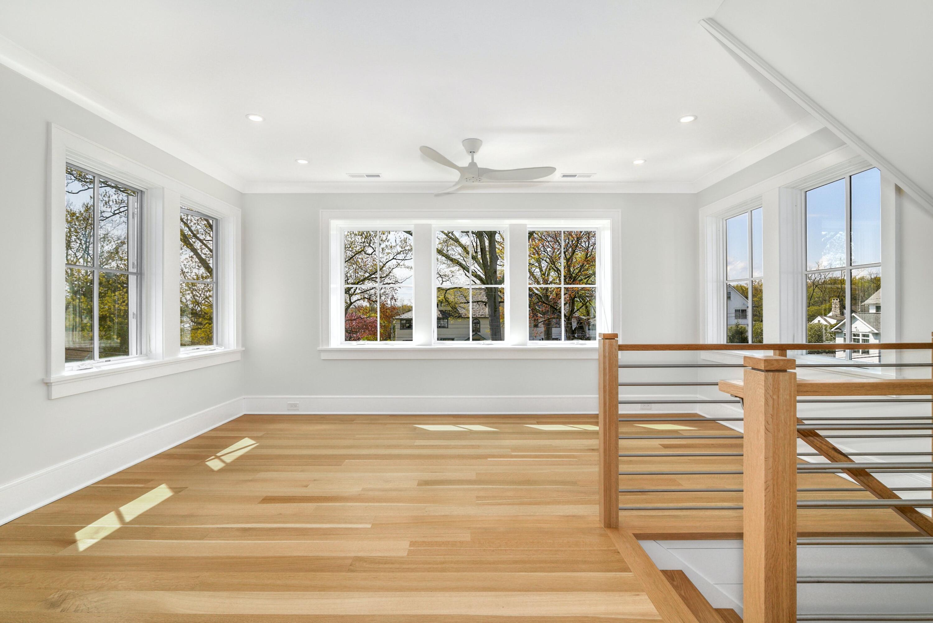15 Waverly Road Darien, CT 06820 - Photo 20 of 36 a view of an empty room with wooden floor and a window