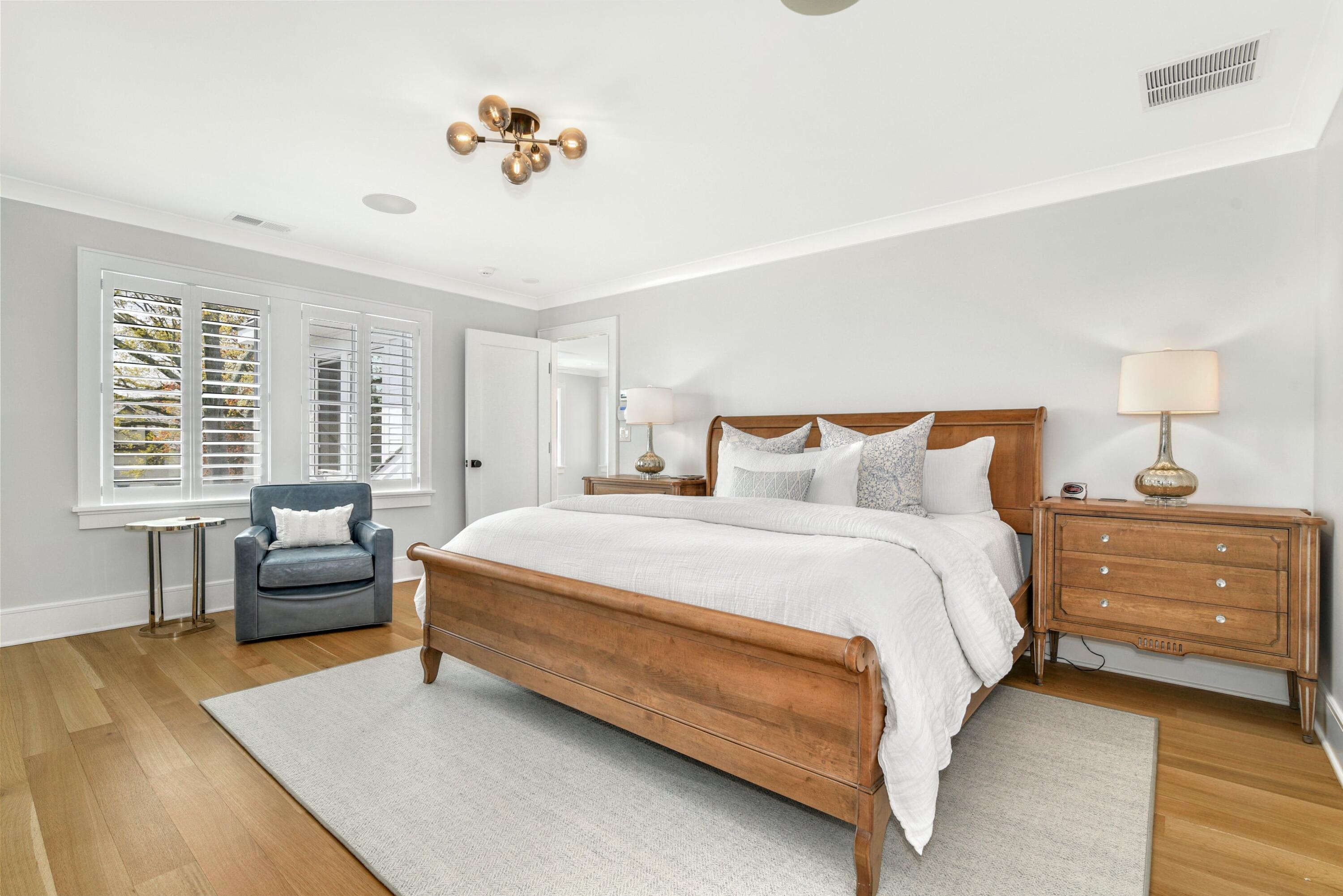 15 Waverly Road Darien, CT 06820 - Photo 22 of 36 a spacious bedroom with a bed and a couch