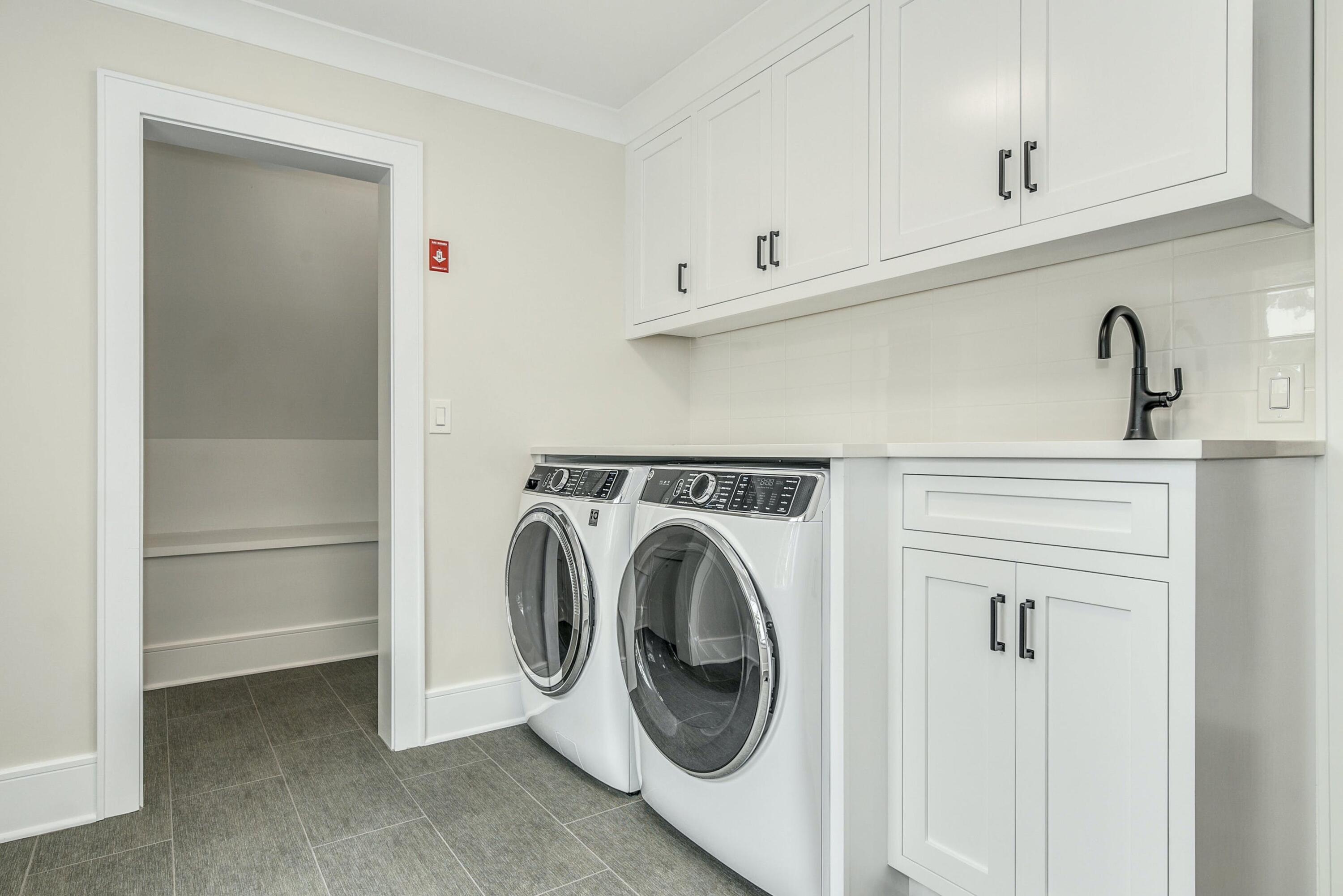 15 Waverly Road Darien, CT 06820 - Photo 30 of 36 a utility room with dryer and washer
