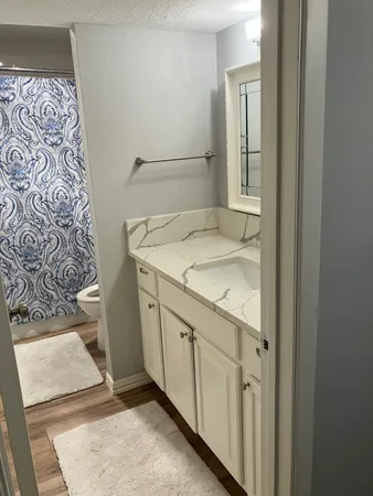 a bathroom with a sink and vanity