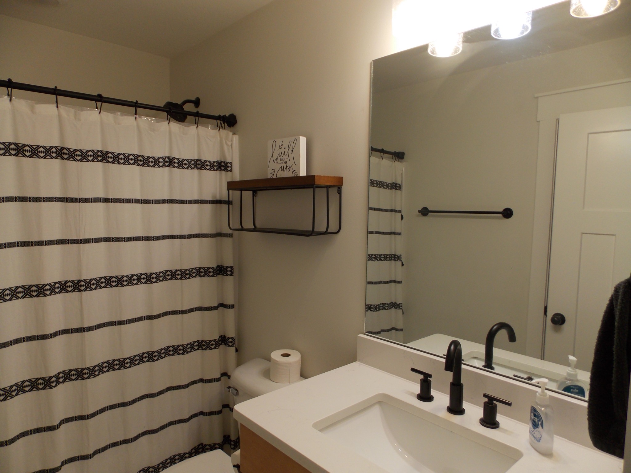 245 Tom Ferrell Road Portland, TN 37148 - Photo 20 of 27 a bathroom with a sink and a mirror