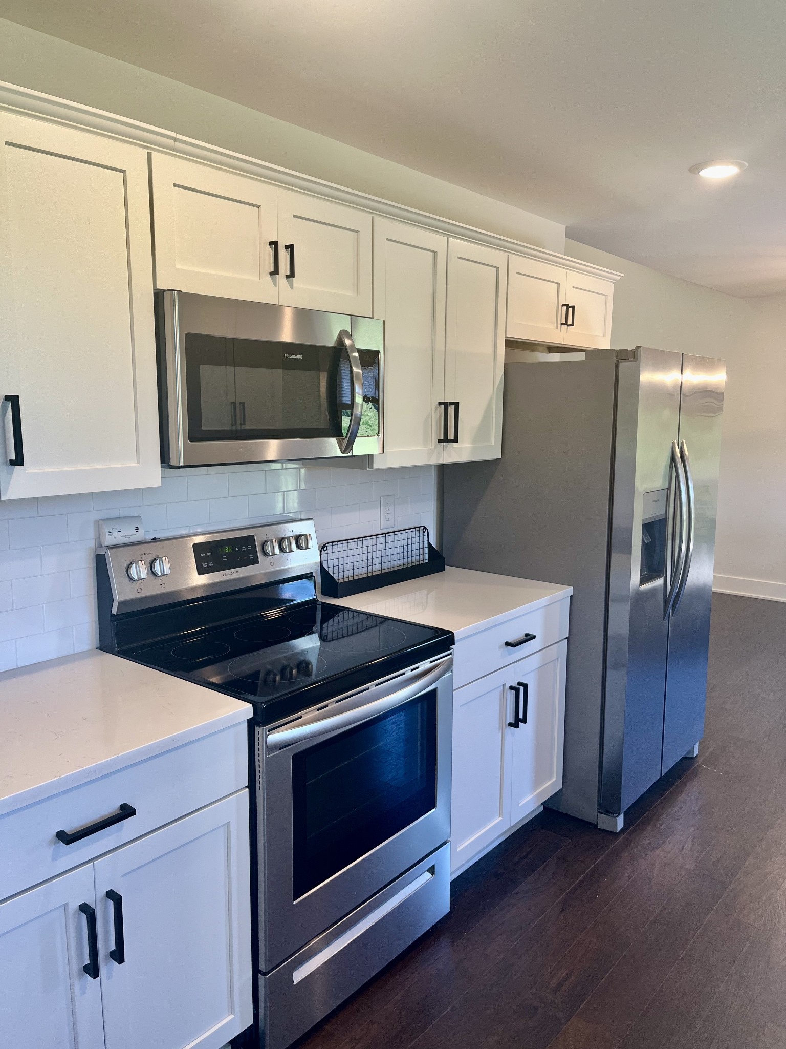 245 Tom Ferrell Road Portland, TN 37148 - Photo 10 of 27 a kitchen with stainless steel appliances a stove a microwave and cabinets