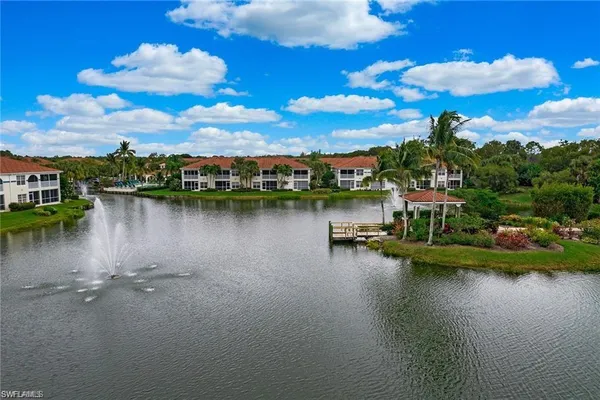 a view of a lake with houses in the back