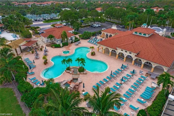 an aerial view of residential house with outdoor space and pool