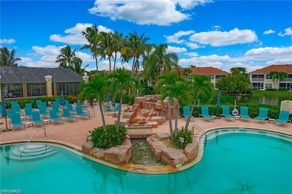 a view of a swimming pool with a patio