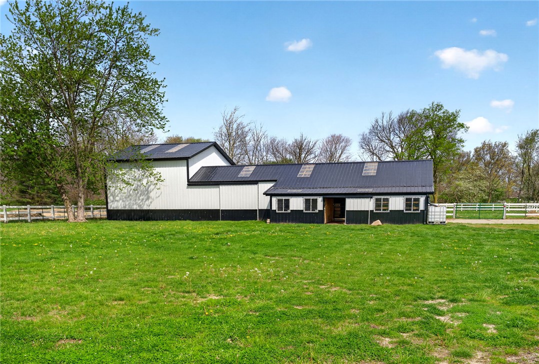 7988 McCool Road Greenville, OH 45331 - Photo 28 of 50 This expansive property features a well-maintained barn, perfect for equestrian enthusiasts or agricultural pursuits.