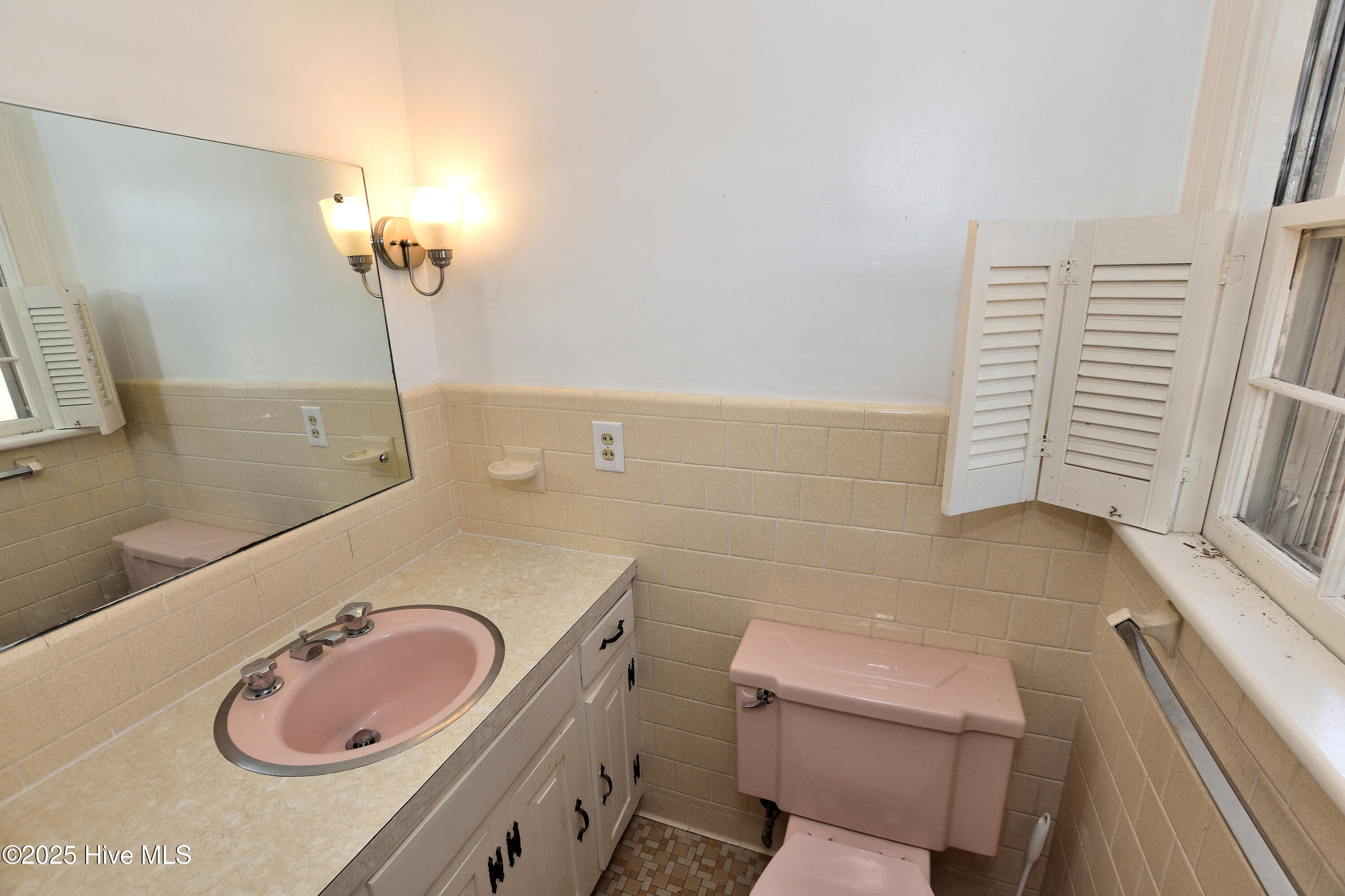 1301 Goldrock Road Rocky Mount, NC 27804 - Photo 29 of 32 1/2 bath in the primary bedroom
