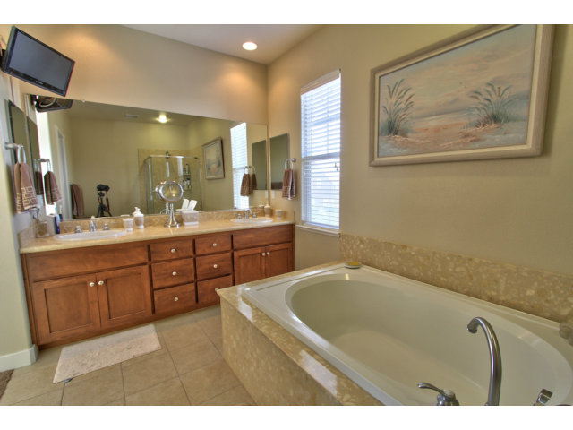 127 Fourth Street Spreckels, CA 93962 - Photo 11 of 20 a spacious bathroom with a tub sink and mirror