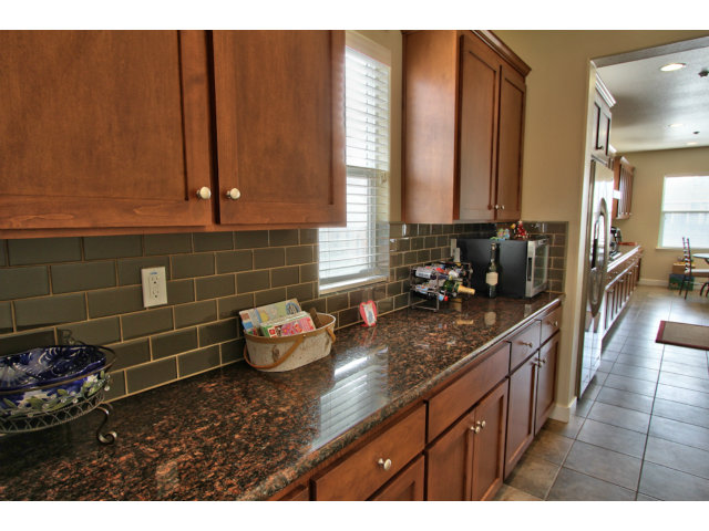 127 Fourth Street Spreckels, CA 93962 - Photo 4 of 20 a kitchen with a sink and a wooden cabinets