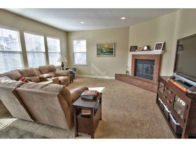 127 Fourth Street Spreckels, CA 93962 - Photo 6 of 20 a living room with furniture a flat screen tv and a fireplace