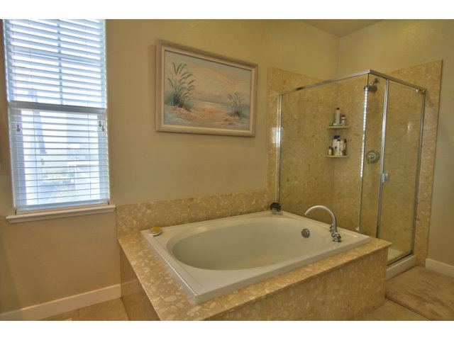 127 Fourth Street Spreckels, CA 93962 - Photo 10 of 20 a bathroom with a bathtub and a shower