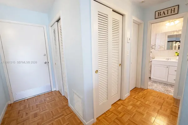 a picture of a wall with a white cabinet