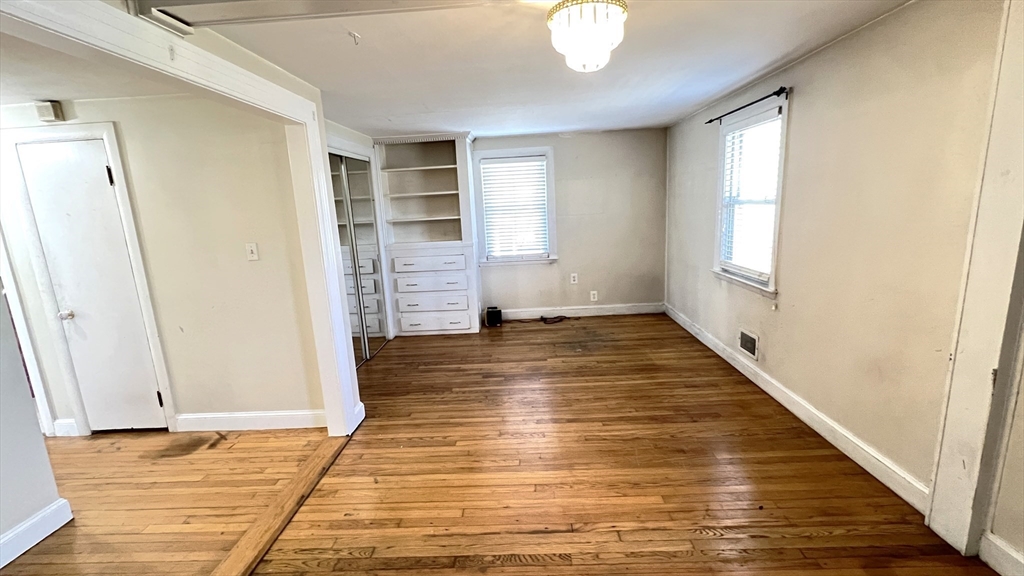 2 Carpenter Road Lynnfield, MA 01940 - Photo 11 of 20 a view of empty room with wooden floor and fan