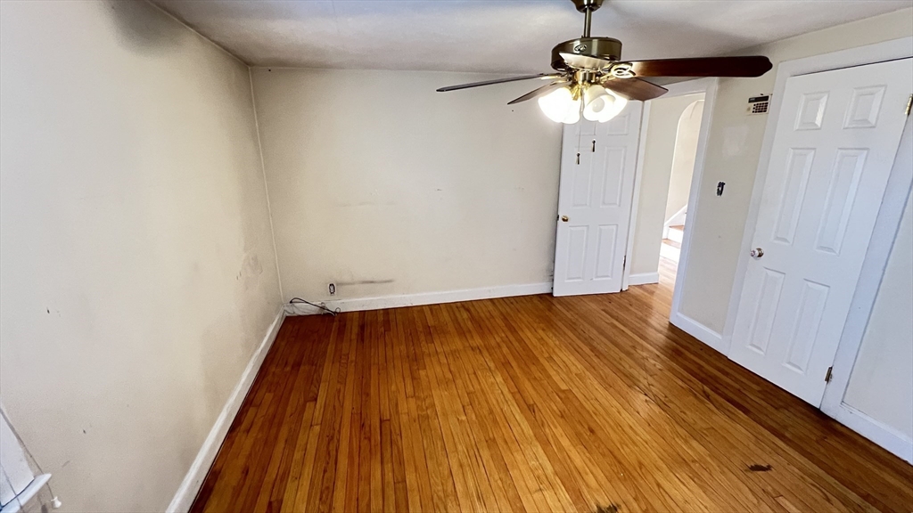 2 Carpenter Road Lynnfield, MA 01940 - Photo 12 of 20 a view of a room with wooden floor and staircase