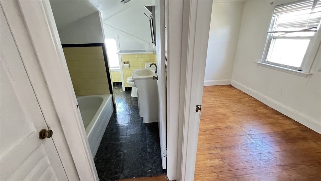 2 Carpenter Road Lynnfield, MA 01940 - Photo 17 of 20 a view of a hallway with wooden floor and staircase