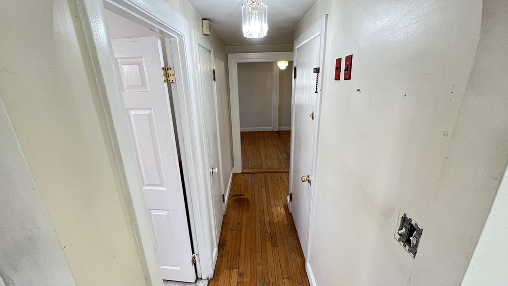2 Carpenter Road Lynnfield, MA 01940 - Photo 8 of 20 a view of a hallway with wooden floor and staircase